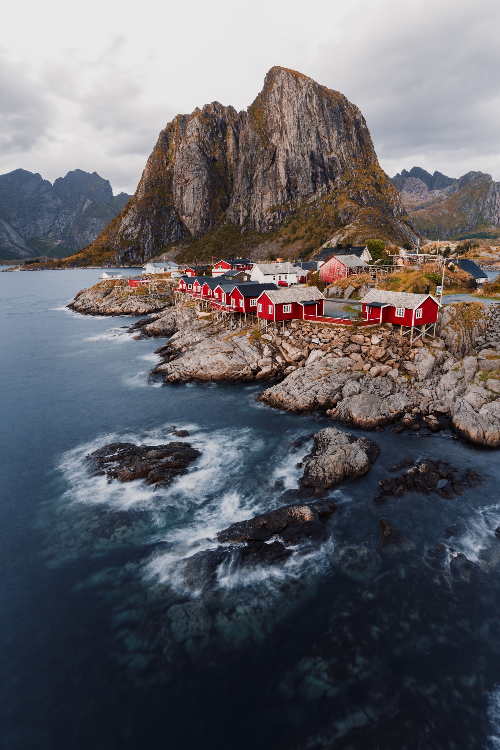 Traditional red rorbuer fishing cabins beside the sea in the Lofoten Islands