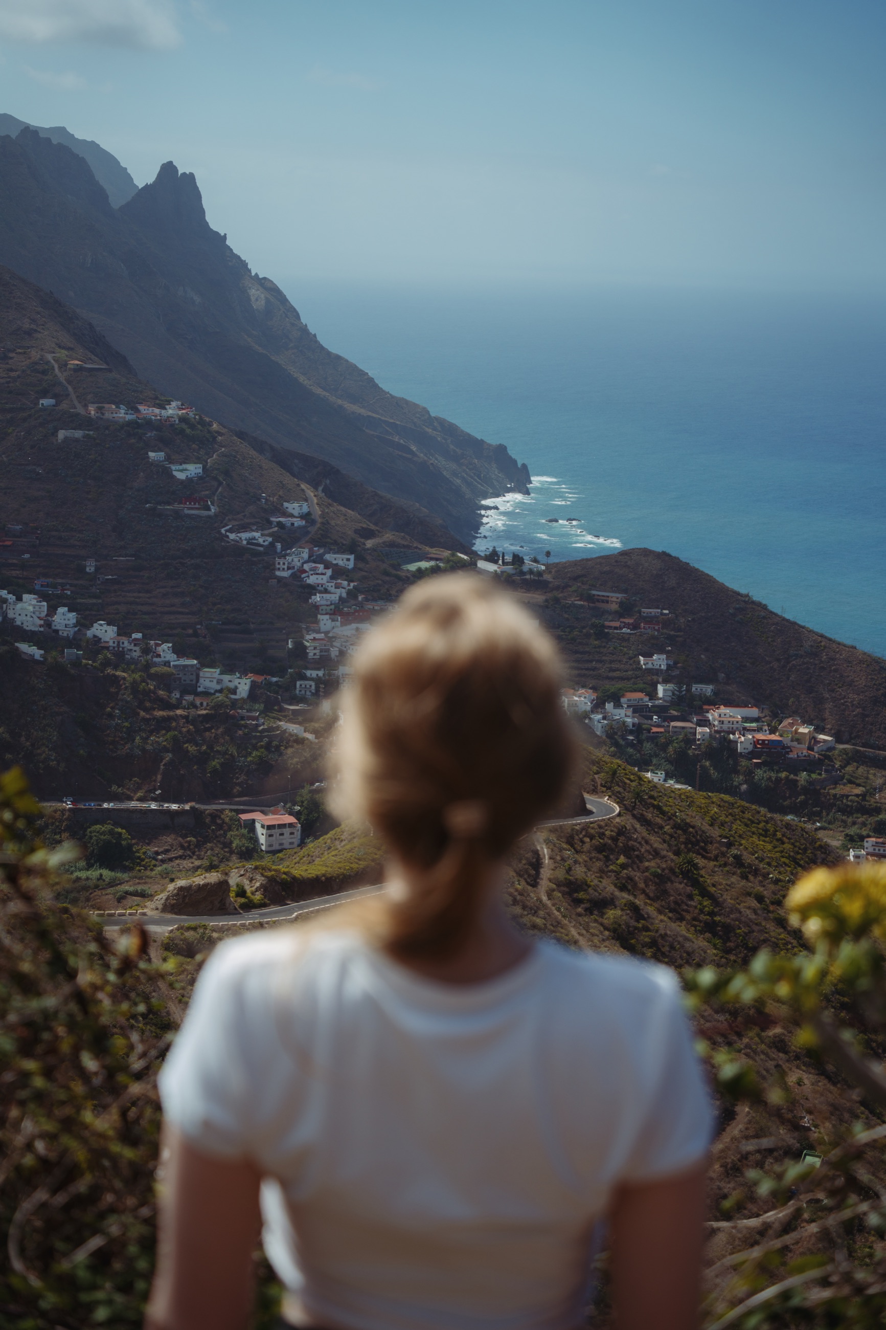 Person looking towards Tenerife’s rugged mountain coastline